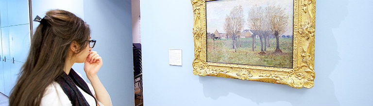 female student in art gallery