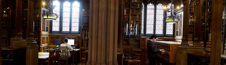 students in wood panelled library